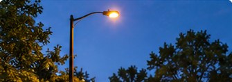 Streetlight illuminated at dusk